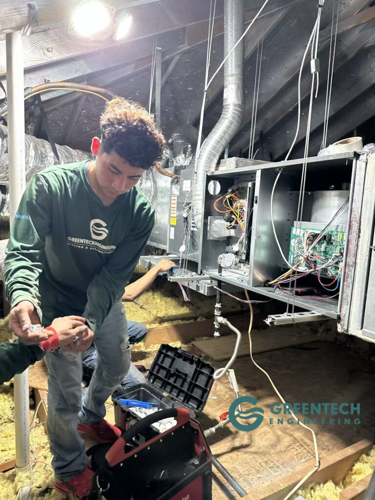 Greentech Engineering technicians replacing old Trane system with new Daikin Fit outdoor condenser and plenum in Sachse Texas and install Daikin furnace